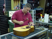 Tony installing a fret