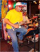 Darrell "Chops" Hill with his homemade Cigar Box Guitar